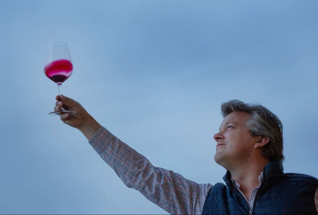Lauren Rosillo inspecting wine glass – winemaker of Laylo Malbec 2023