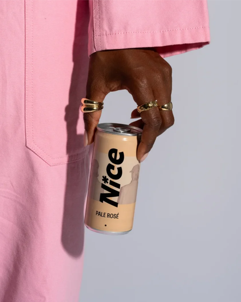 Nice Pale Rosé canned wine held in hand, crafted from Grenache grapes with delicate strawberry and raspberry aromas.