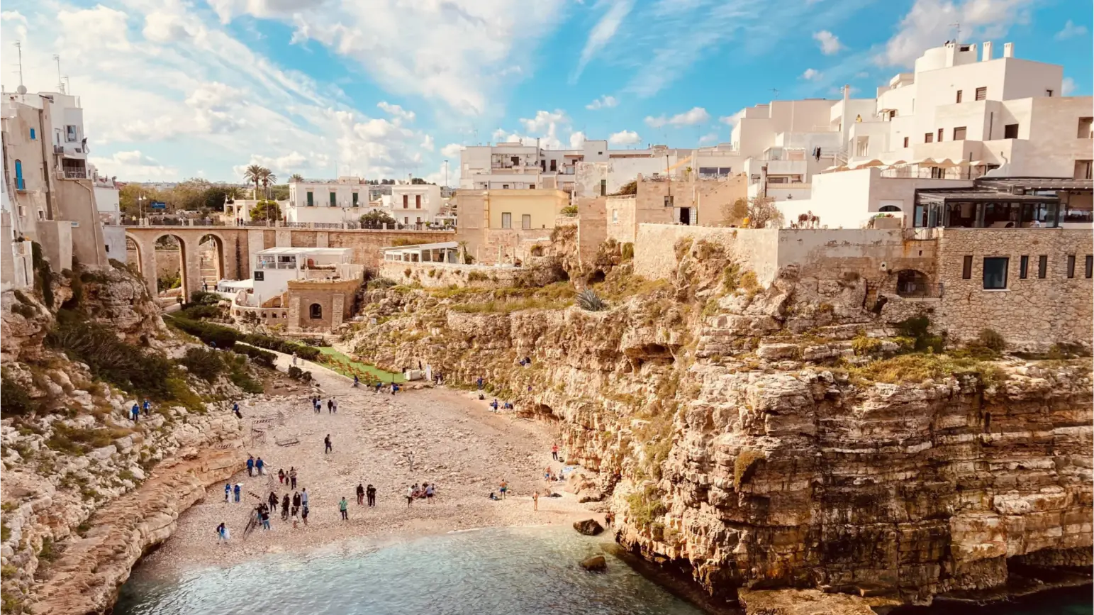 Scenic view of Puglia with limestone villages and coastline, reflecting the cultural heritage behind The Copper Crew wines