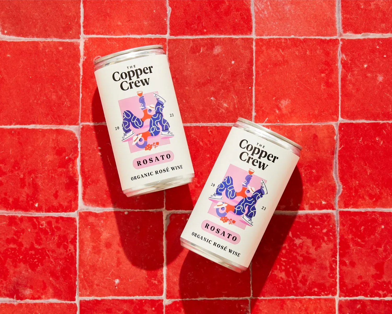 The Copper Crew Organic Rosato canned rosé wine – fresh and floral Italian wine on a red background