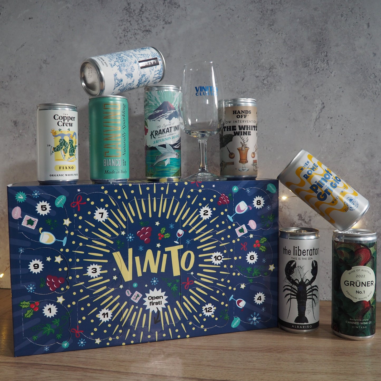 A festive countdown featuring 12 cans of white wine, displayed in festive packaging.