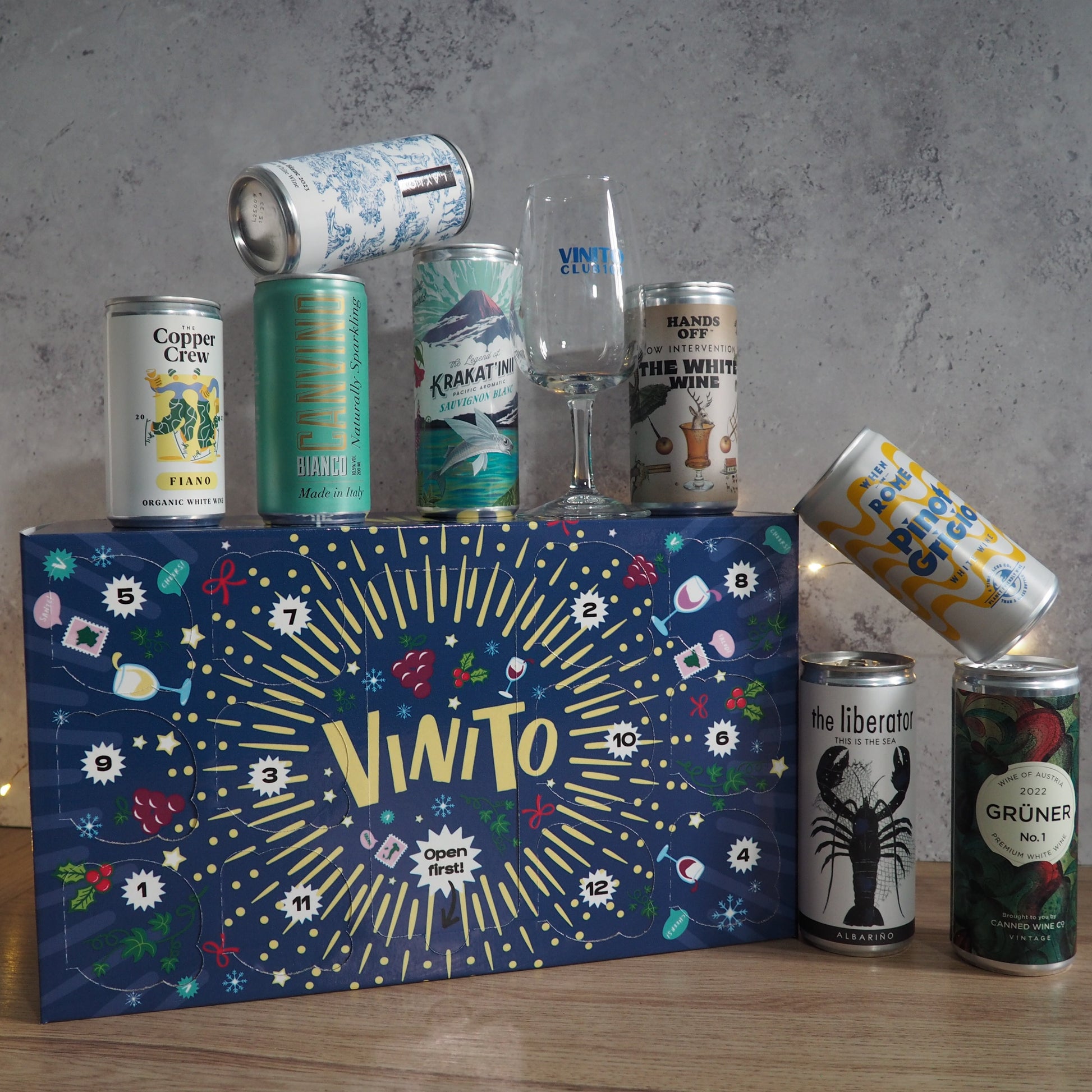 A festive countdown featuring 12 cans of white wine, displayed in festive packaging.