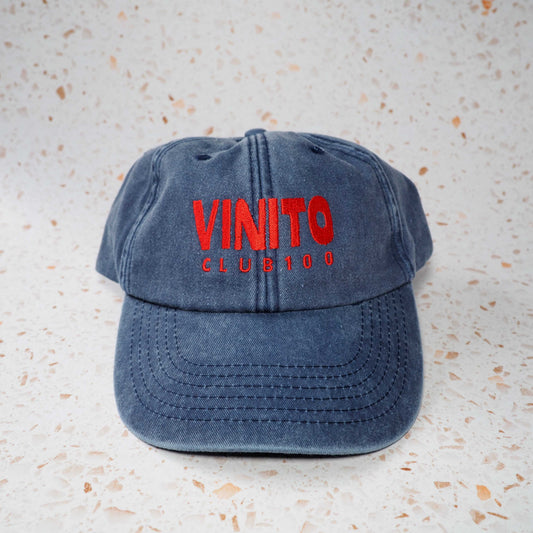 Blue Vinito denim cap with red embroidery text.